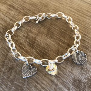 2 single fingerprint charm bracelet. Chunky chain with hoop & T-bar clasp and heart crystal