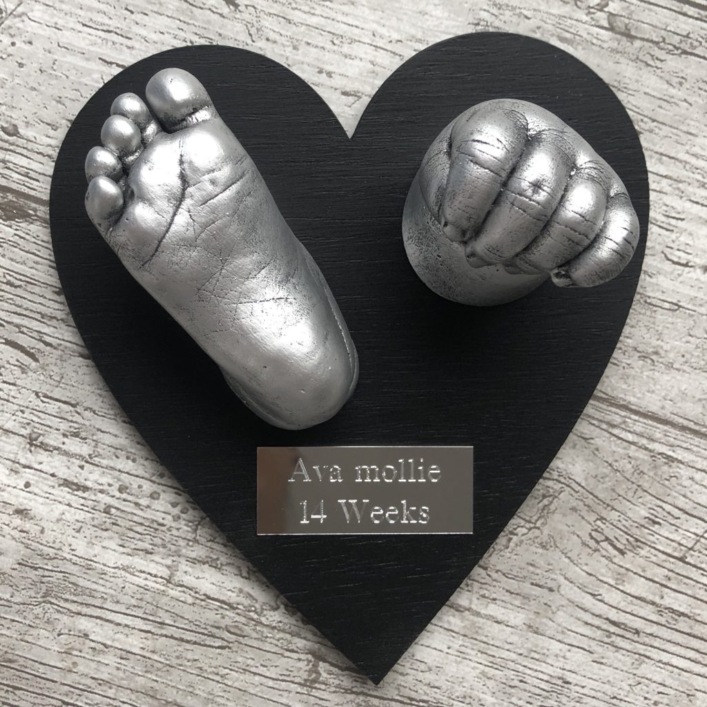 Two 3D Baby castings on a heart