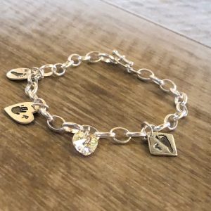 3 hand or footprint charm bracelet. Chunky chain with hoop & T-bar clasp and heart crystal